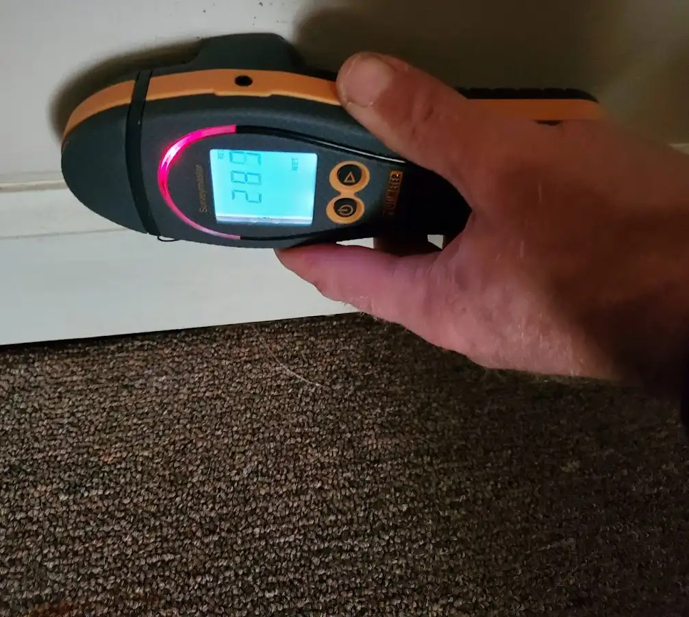 Moisture detection at baseboard during Storm Damage Restoration in Kanab